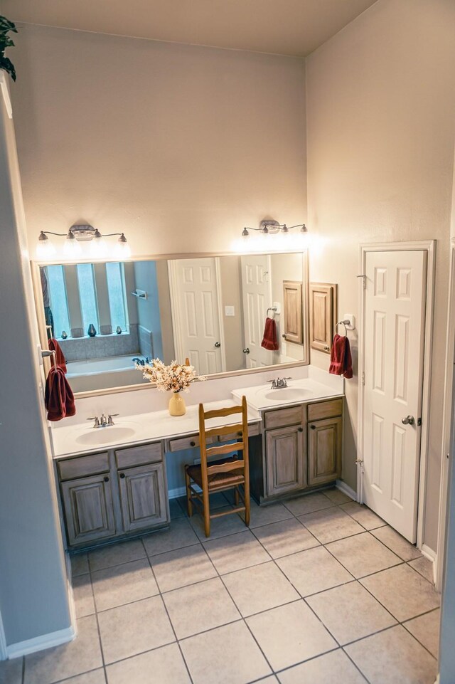 13926 Wessex Park Dr, Cypress, TX 77429 - bathroom featuring tile patterned floors, double vanity, and a bath