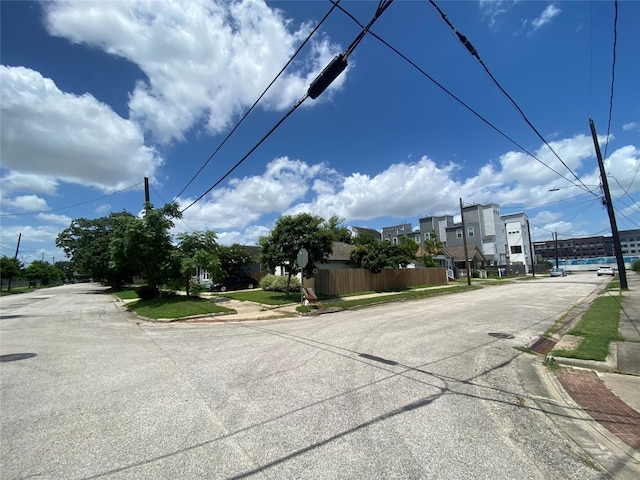 3305 Pease St, Houston, TX 77003 - view of asphalt road featuring sidewalks, curbs, and traffic signs