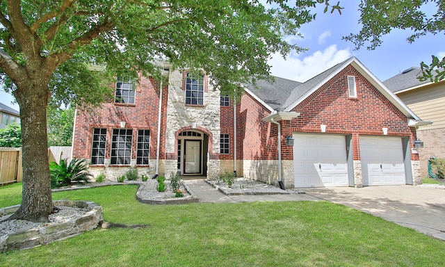 15915 Angler Bend Dr, Houston, TX 77044 - traditional-style house featuring driveway, an attached garage, stone siding, and brick siding