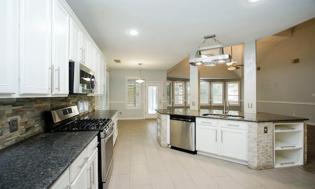 15915 Angler Bend Dr, Houston, TX 77044 - kitchen with appliances with stainless steel finishes, a sink, tasteful backsplash, a ceiling fan, and white cabinets