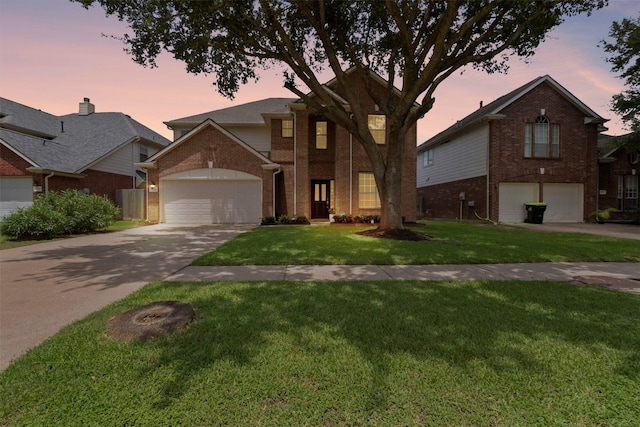 21519 Canyon Terrace Ln, Katy, TX 77450 - traditional home with brick siding, concrete driveway, a front lawn, and an attached garage