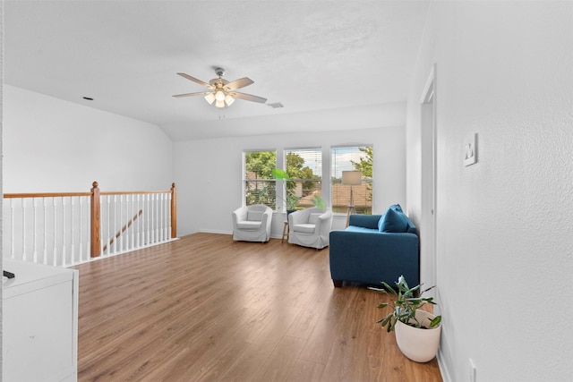 21519 Canyon Terrace Ln, Katy, TX 77450 - living area with a ceiling fan, wood finished floors, and an upstairs landing
