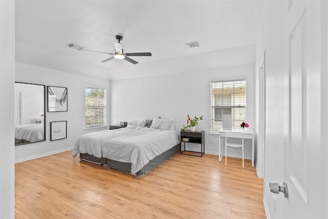 21519 Canyon Terrace Ln, Katy, TX 77450 - bedroom featuring light wood-style flooring, baseboards, and ceiling fan