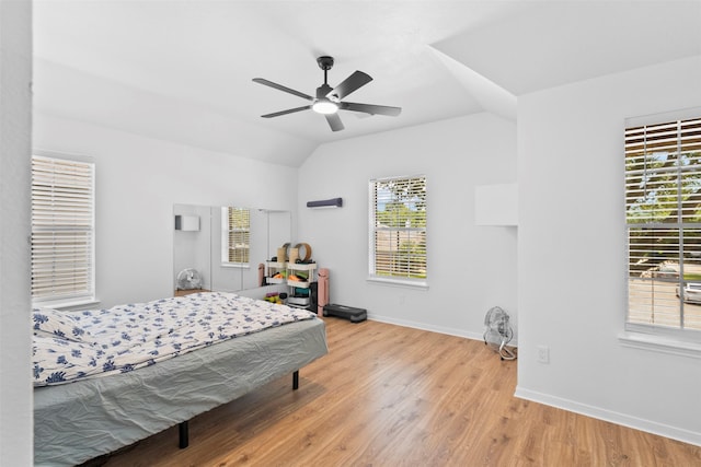 21519 Canyon Terrace Ln, Katy, TX 77450 - bedroom with vaulted ceiling, baseboards, wood finished floors, and ceiling fan