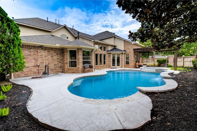 21622 Sabine Pass Ct, Katy, TX 77450 - view of pool with a pergola, a pool with connected hot tub, a patio, and french doors