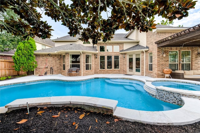 21622 Sabine Pass Ct, Katy, TX 77450 - view of swimming pool featuring a pool with connected hot tub and a patio