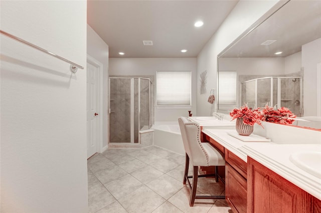 21622 Sabine Pass Ct, Katy, TX 77450 - full bath featuring double vanity, a bath, a stall shower, recessed lighting, and tile patterned flooring