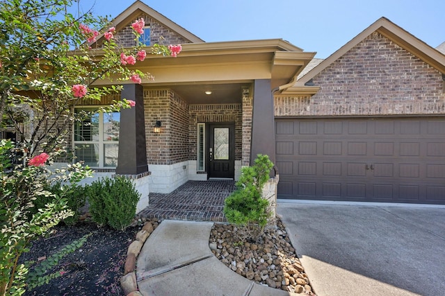 10315 Silver Shield Way, Tomball, TX 77375 - view of front of home with a garage, brick siding, and driveway