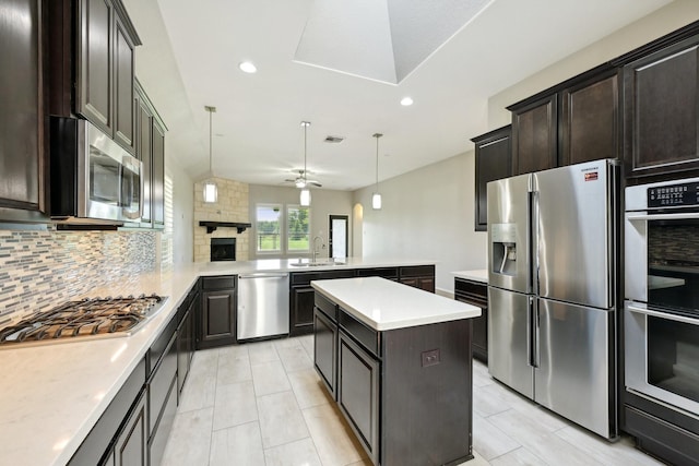 10315 Silver Shield Way, Tomball, TX 77375 - kitchen with stainless steel appliances, a sink, decorative backsplash, a peninsula, and light countertops