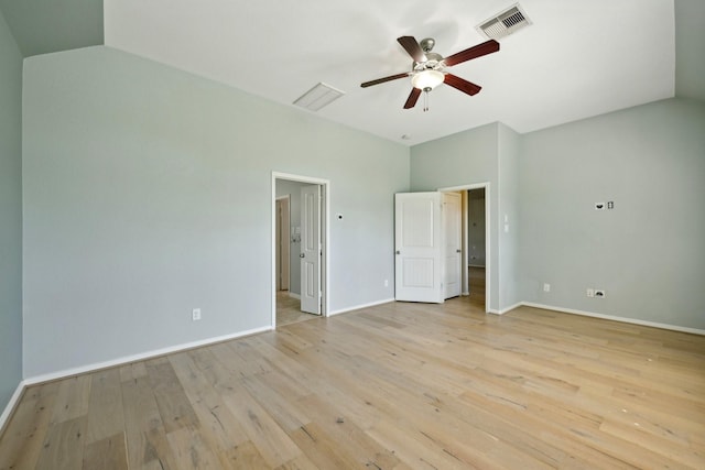 10315 Silver Shield Way, Tomball, TX 77375 - unfurnished bedroom with light wood finished floors, baseboards, vaulted ceiling, and a ceiling fan