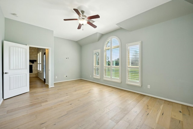 10315 Silver Shield Way, Tomball, TX 77375 - spare room with light wood-style floors, baseboards, a ceiling fan, and lofted ceiling
