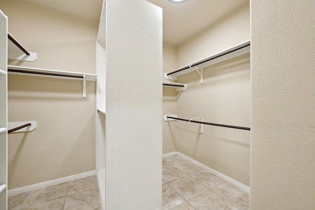 10315 Silver Shield Way, Tomball, TX 77375 - walk in closet featuring tile patterned flooring