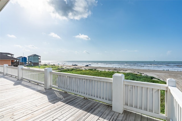 852 W Lazy Ln, Crystal Beach, TX 77650 - wooden deck featuring view of water and beach