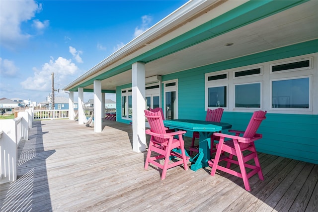 852 W Lazy Ln, Crystal Beach, TX 77650 - wooden terrace with outdoor dining area