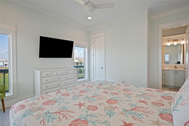 852 W Lazy Ln, Crystal Beach, TX 77650 - bedroom featuring crown molding, multiple windows, ensuite bath, wood finished floors, and ceiling fan