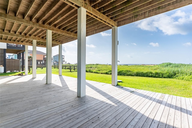 852 W Lazy Ln, Crystal Beach, TX 77650 - wooden deck with a lawn
