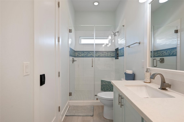 852 W Lazy Ln, Crystal Beach, TX 77650 - bathroom featuring vanity, a stall shower, and wood finished floors