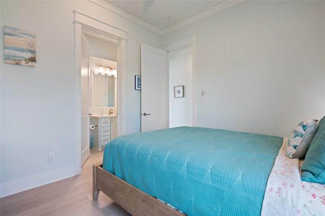 852 W Lazy Ln, Crystal Beach, TX 77650 - bedroom featuring light wood-style flooring, ornamental molding, connected bathroom, and ceiling fan