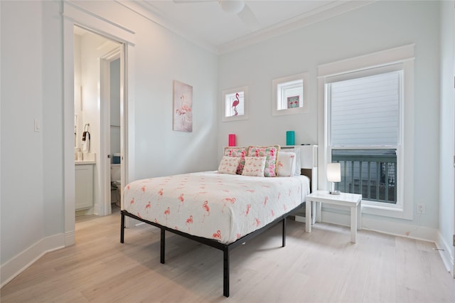 852 W Lazy Ln, Crystal Beach, TX 77650 - bedroom featuring crown molding, light wood finished floors, ensuite bath, and a ceiling fan