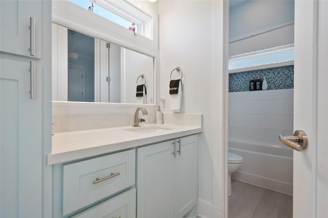 852 W Lazy Ln, Crystal Beach, TX 77650 - bathroom with vanity, wood finished floors, and bathtub / shower combination