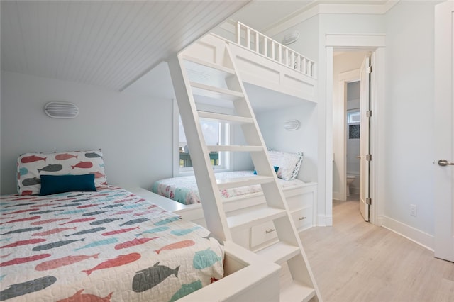 852 W Lazy Ln, Crystal Beach, TX 77650 - bedroom featuring wood finished floors and baseboards
