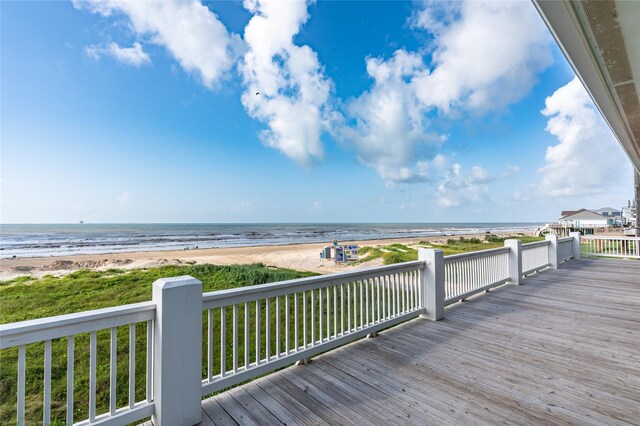 852 W Lazy Ln, Crystal Beach, TX 77650 - wooden deck with view of water and beach