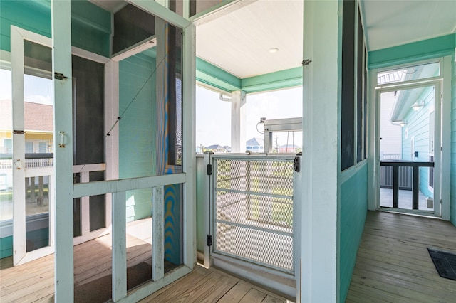 852 W Lazy Ln, Crystal Beach, TX 77650 - doorway to outside with wood finished floors