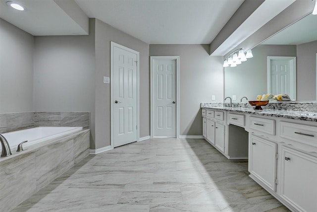 1406 Rustic Knolls Dr, Katy, TX 77450 - full bathroom featuring vanity, a garden tub, marble finish floors, and baseboards