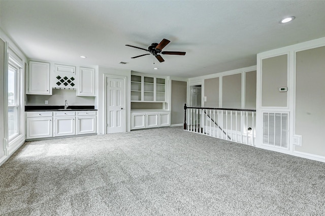 1406 Rustic Knolls Dr, Katy, TX 77450 - spare room featuring a ceiling fan, a sink, carpet floors, and recessed lighting