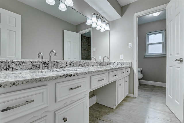 1406 Rustic Knolls Dr, Katy, TX 77450 - full bathroom with double vanity and toilet