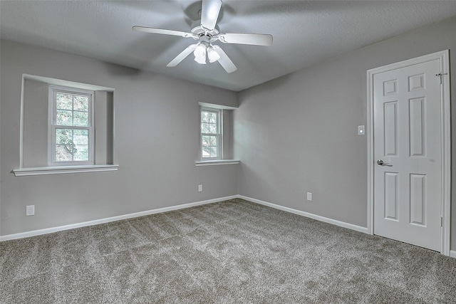 1406 Rustic Knolls Dr, Katy, TX 77450 - carpeted empty room with a ceiling fan and baseboards