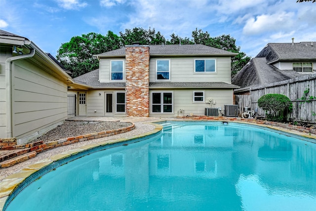 1406 Rustic Knolls Dr, Katy, TX 77450 - view of swimming pool with central air condition unit and a patio area