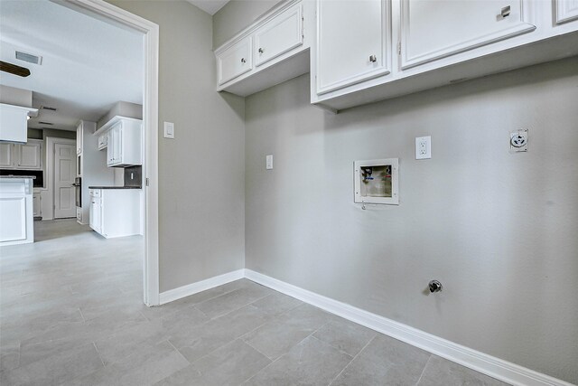 1406 Rustic Knolls Dr, Katy, TX 77450 - laundry area with washer hookup, baseboards, gas dryer hookup, and light tile patterned flooring
