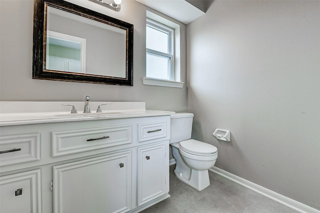1406 Rustic Knolls Dr, Katy, TX 77450 - bathroom with baseboards, vanity, and toilet