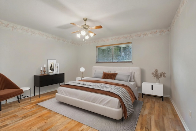 21707 Glenbranch Dr, Spring, TX 77388 - bedroom featuring wood finished floors, baseboards, and a ceiling fan