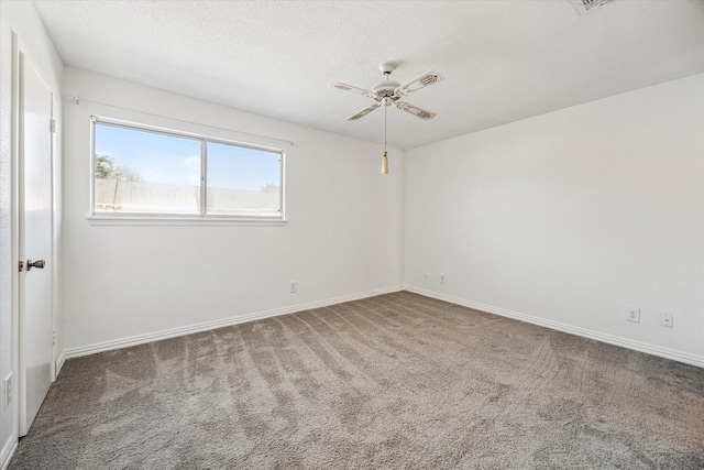 6111 Beverly Hill St Unit 39, Houston, TX 77057 - carpeted spare room with a ceiling fan, baseboards, and a textured ceiling