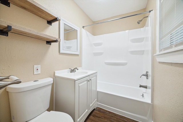 4446 Castor St, Houston, TX 77022 - full bath featuring vanity, toilet, tub / shower combination, wood finished floors, and a textured wall