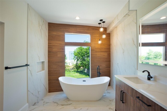 2117A Sauer, Houston, TX 77004 - bathroom with a freestanding tub, vanity, marble finish floors, and recessed lighting