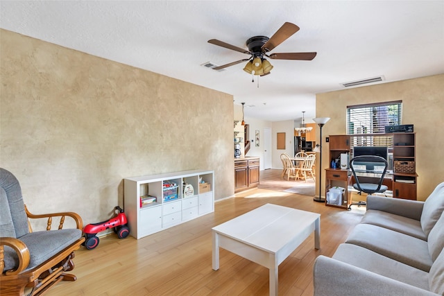3734 Glade Forest Dr, Kingwood, TX 77339 - living area with light wood finished floors and a ceiling fan