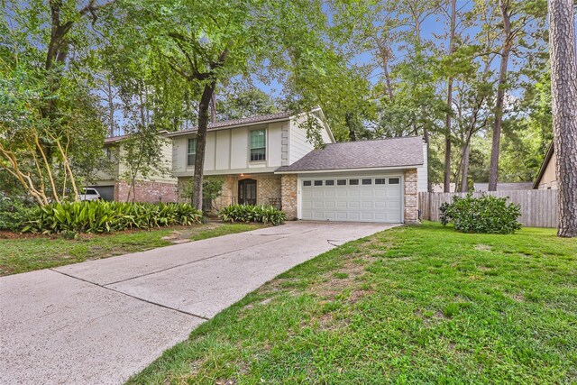 3734 Glade Forest Dr, Kingwood, TX 77339 - view of front of property featuring a garage, concrete driveway, and brick siding