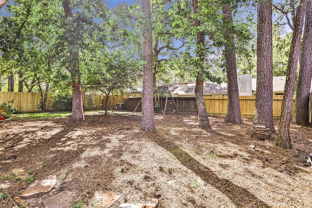 3734 Glade Forest Dr, Kingwood, TX 77339 - fenced backyard with a playground