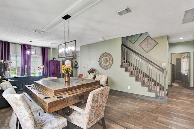 6706 Lindale Manor Ct, Spring, TX 77379 - dining room with wood finished floors, stairway, and a chandelier