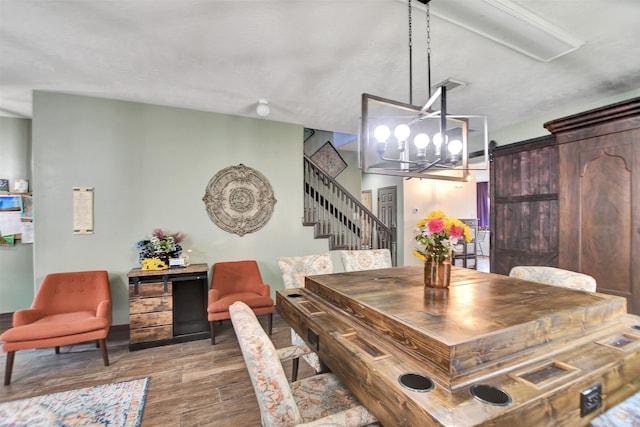 6706 Lindale Manor Ct, Spring, TX 77379 - dining area featuring wood finished floors, stairway, and a chandelier