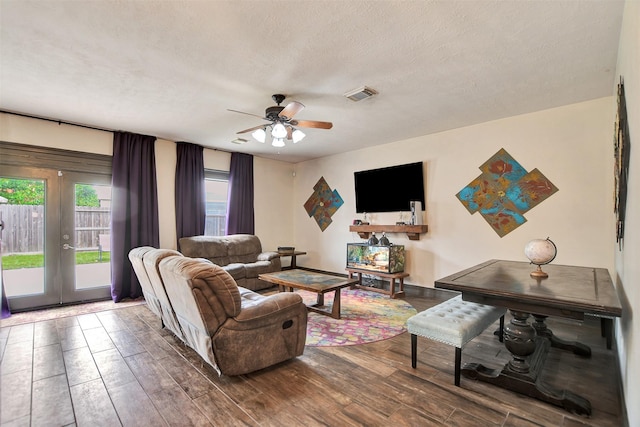 6706 Lindale Manor Ct, Spring, TX 77379 - living area featuring ceiling fan, wood finished floors, a textured ceiling, and french doors