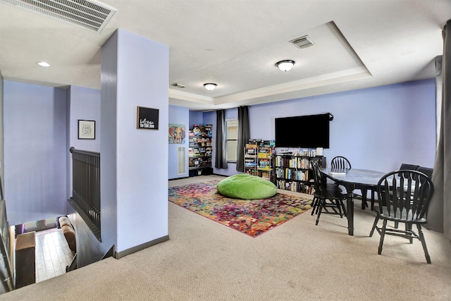 6706 Lindale Manor Ct, Spring, TX 77379 - living room featuring a raised ceiling and carpet floors
