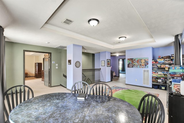 6706 Lindale Manor Ct, Spring, TX 77379 - dining room with a tray ceiling, carpet flooring, and crown molding