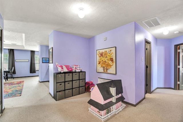 6706 Lindale Manor Ct, Spring, TX 77379 - corridor featuring carpet, baseboards, and a textured ceiling