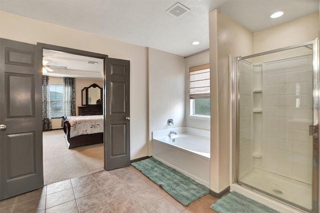 6706 Lindale Manor Ct, Spring, TX 77379 - bathroom with a bath, plenty of natural light, tile patterned floors, a shower stall, and recessed lighting