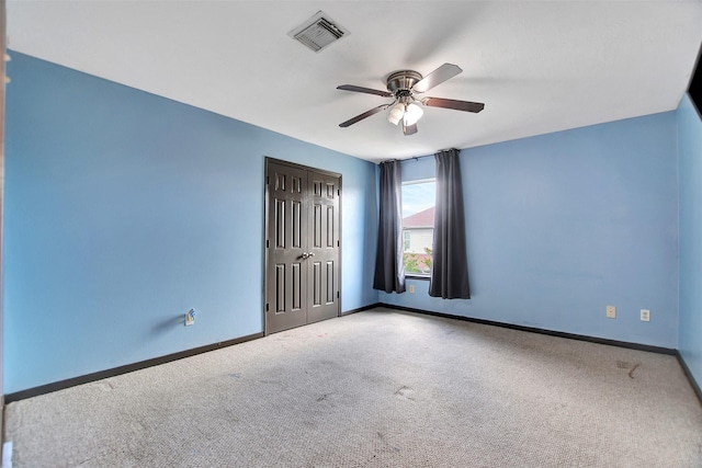 6706 Lindale Manor Ct, Spring, TX 77379 - unfurnished bedroom with carpet flooring, a closet, and a ceiling fan