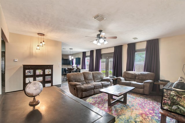 6706 Lindale Manor Ct, Spring, TX 77379 - living room featuring ceiling fan and a textured ceiling